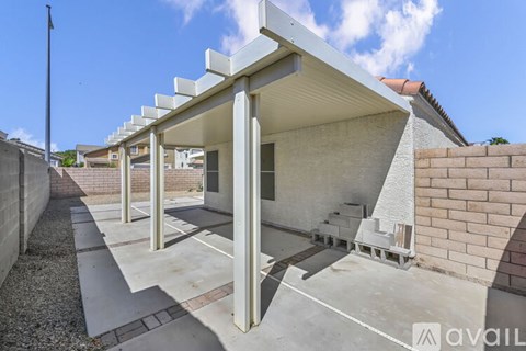 A modern house with a white exterior and a covered walkway.