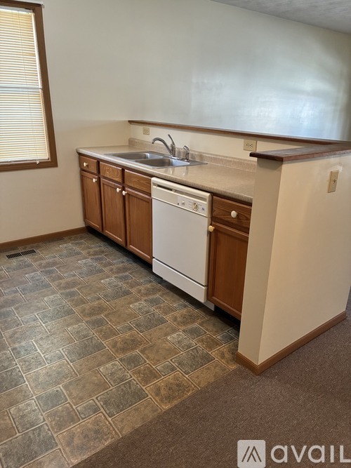 A kitchen with a washer and dryer built in.