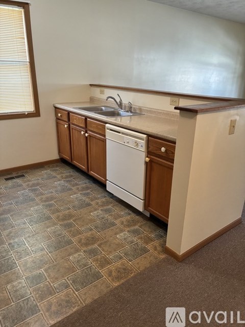A kitchen with a washer and dryer built in.