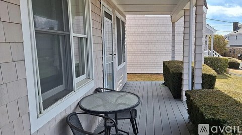 A patio with a table and chairs is available for rent.