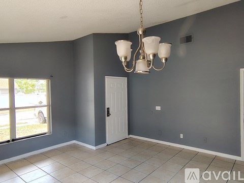 A room with grey walls and a white door.