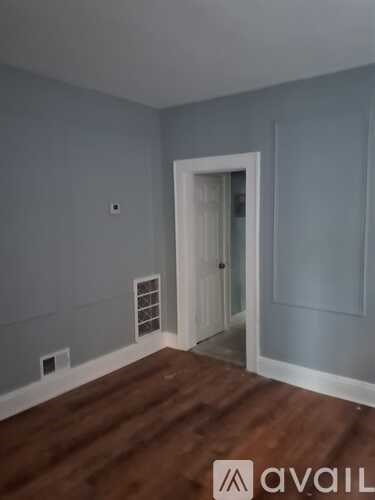 A room with a door and a window.