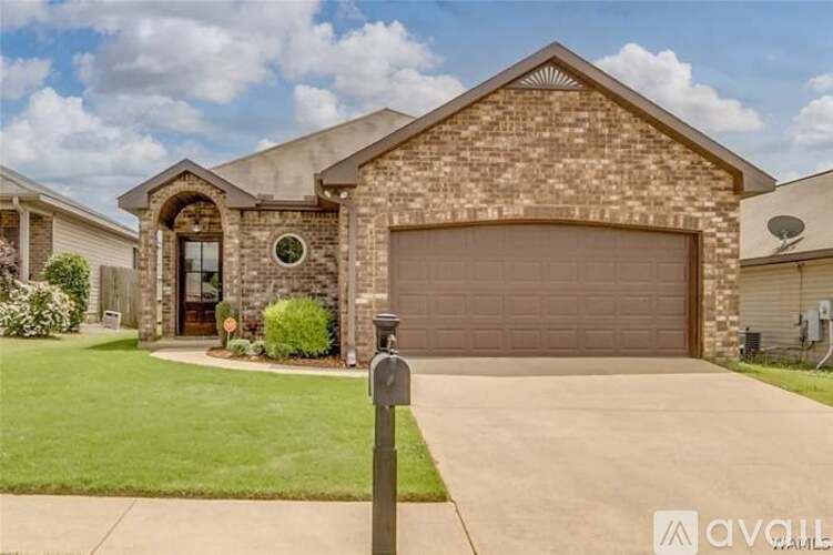 A house with a brown garage door and a driveway.