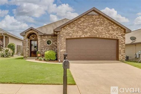A house with a brown garage door and a driveway.