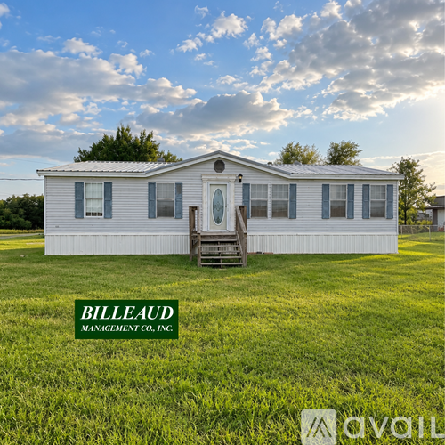 A white house with a green logo that says "BILLEAUD MANAGEMENT CO. INC." in front of it.