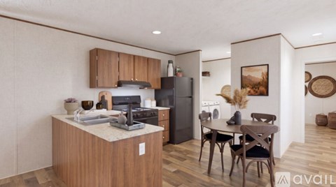 A kitchen with wooden cabinets and a dining table with chairs.