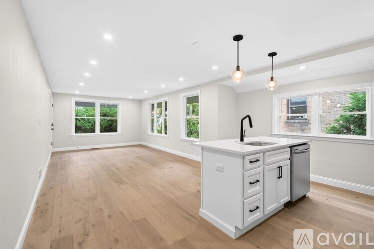 A kitchen with a white cabinet and drawers is available for rent.