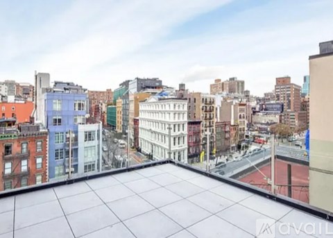 A view from a high-rise building overlooking a cityscape.