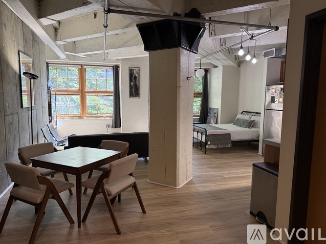 A room with a table and chairs in it.