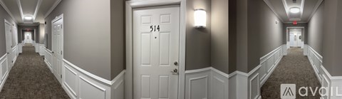A hallway with a door numbered 514.