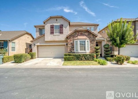 A house with a garage is available for sale.