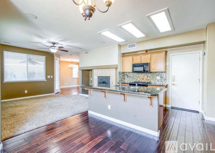 A kitchen with a countertop and a microwave on it.