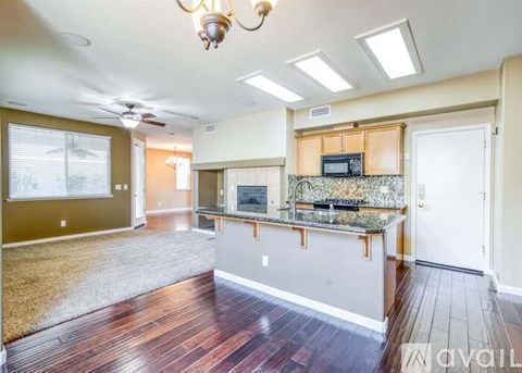 A kitchen with a countertop and a microwave on it.