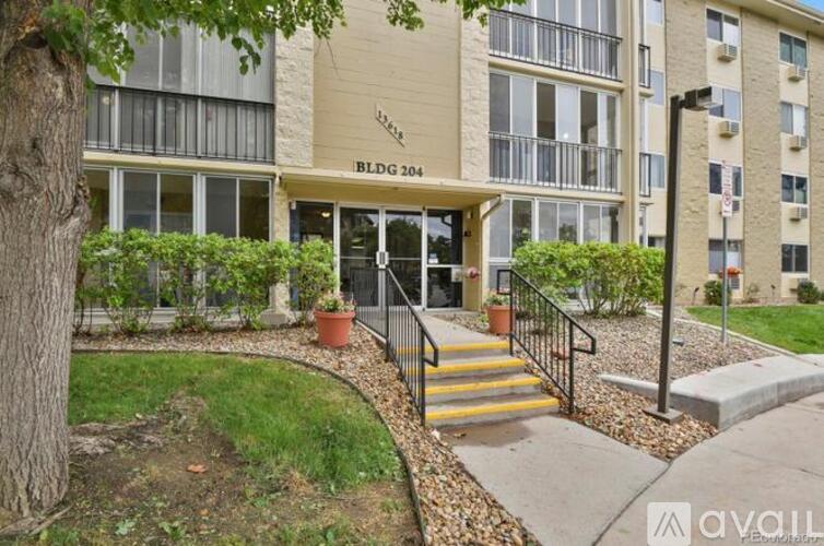 The image shows the front of a building named BLDG 204 with a staircase leading to the entrance.