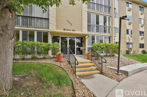 The image shows the front of a building named BLDG 204 with a staircase leading to the entrance.