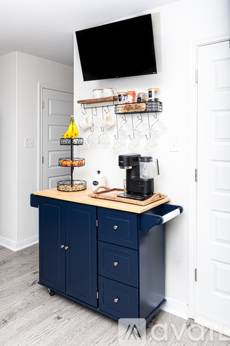 A kitchen island with a coffee maker on top.