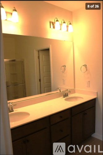 A bathroom with a sink and mirror.