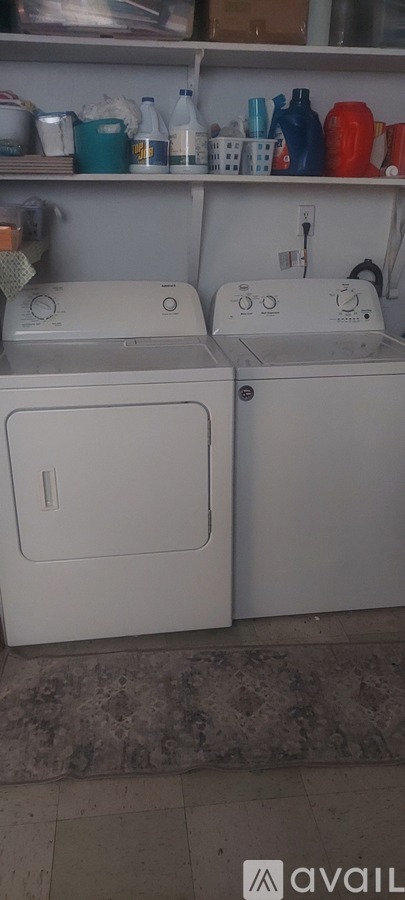 Two washing machines in a laundry room.