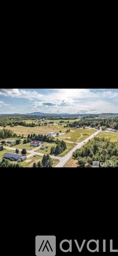 A bird's eye view of a residential area with houses and trees.
