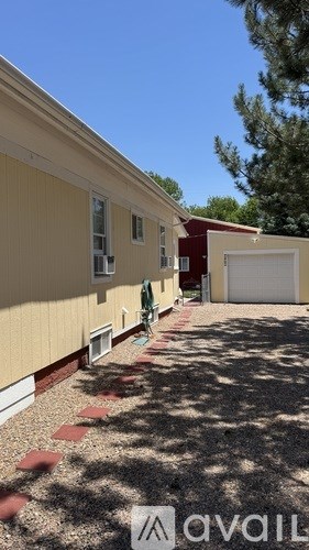 A house with a garage is for sale.
