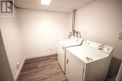 A laundry room with a washer and dryer in it.