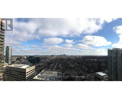 A view of a cityscape from a high vantage point with the text "REMAX WEST REALTY INC. Brokerage" visible.