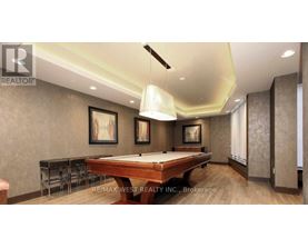 A pool table in a room with a brown wall and a painting hanging on it.