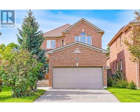 A large brick house with a garage is for sale.