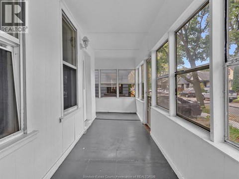 A long hallway with windows on both sides.