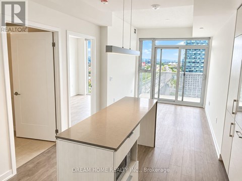 A kitchen with a view of the city.