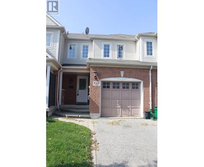 A house with a brown garage door and a white door.