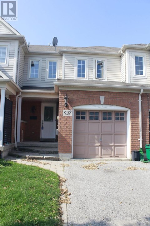 A house with a brown garage door and a white door.