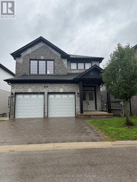 A two-story house with a garage is for sale.