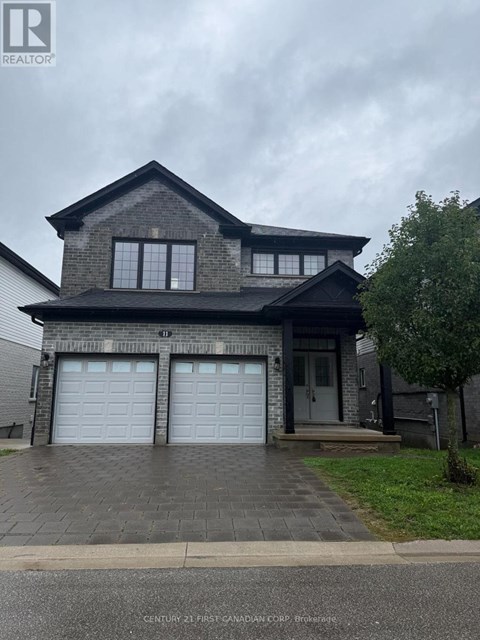 A house with a grey roof and two garage doors.