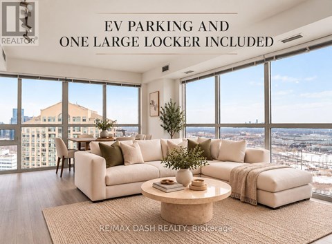 A living room with a large window overlooking a cityscape.