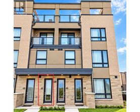 A modern apartment building with balconies and doors numbered 1 to 4.