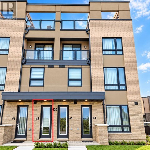 A modern apartment building with balconies and doors numbered 1 to 4.