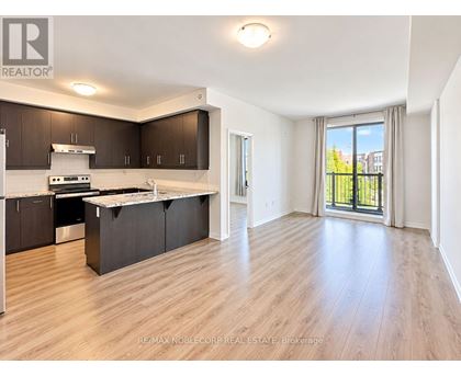 A spacious kitchen with dark brown cabinets and a white countertop.