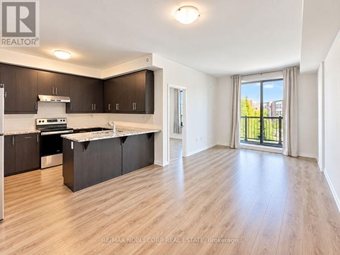 A spacious kitchen with dark brown cabinets and a white countertop.