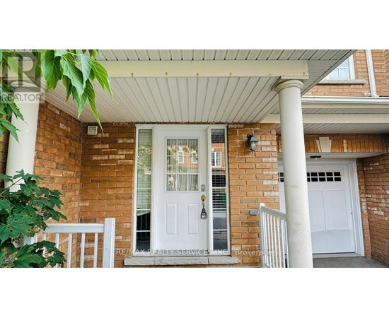 A house with a white door and a porch.