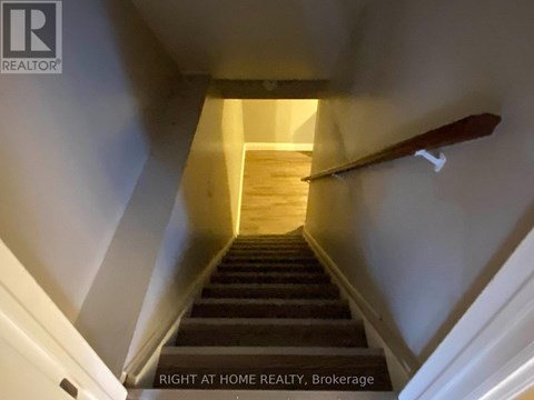 A staircase leading to a bright landing.