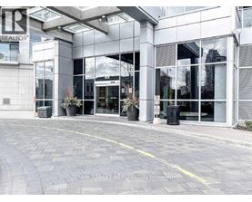 A building with a glass facade and a sign that reads "REALTOR".