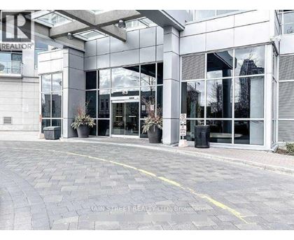 A building with a glass facade and a sign that reads "REALTOR".