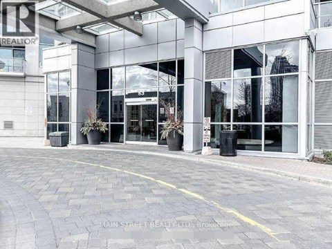A building with a glass facade and a sign that reads "REALTOR".