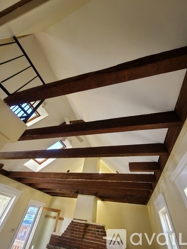 A wooden beam structure in a room.