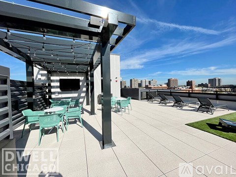 A patio with chairs and a table is available for rent.