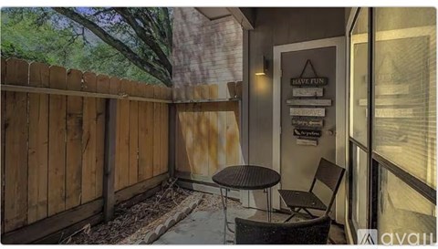 A patio with a table and chairs is available for rent.