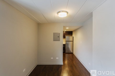 A room with a white ceiling and a wooden floor.