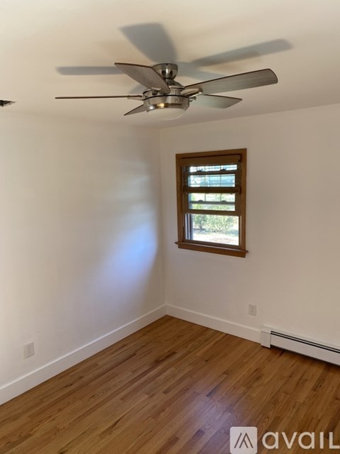 A room with a washing machine and a dryer.