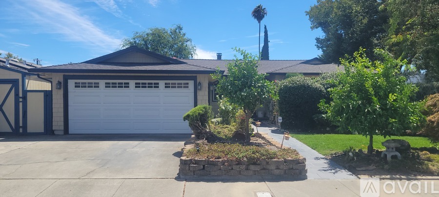 A house with a garage and a driveway.